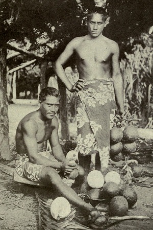 Two Tahitian men preparing breadfruits