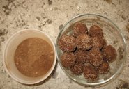 Carob peanut balls (right) and carob powder (left). This batch was rolled in sugar for some sparkle. Sugar is not necessary for taste because carob is naturally sweet.