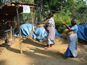 Public display by members of a cooperative making coir rope