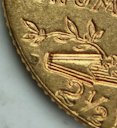 Reverse of a 1911-D Indian Head quarter eagle, detail showing the mintmark.