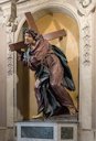 Sculpture of Christ bearing the cross in olive wood in the Nostra Signora del Sacro Cuore church in Rome