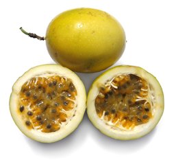 wo ripe yellow passion fruits, one of them opened to show the edible seeds.