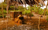 The traditional method of distilling cashew feni