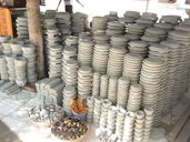 Kyauk pyin stone slabs for grinding thanaka at a pagoda market in Sagaing