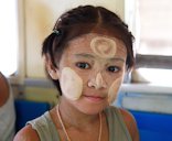 Girl wearing Thanaka paste in Yangon, Myanmar