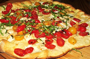pizza with tomatoes and bsasil