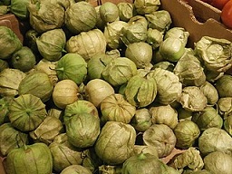 Tomatillos in a box at a grocery store